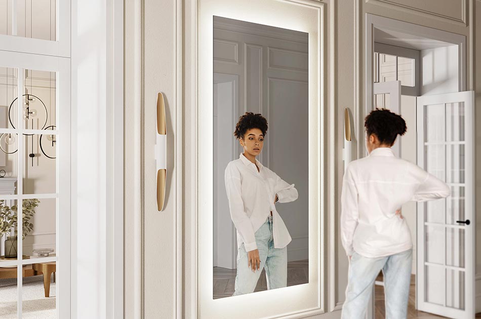 El espejo de baño LED Ambient Line es una combinación de diseño moderno y elegancia. Su iluminación decorativa es ideal tanto para habitaciones grandes como pequeñas. El haz de luz de los productos Ambient Line es delicado y difuso, y recae sobre la pared en la que está colgado el espejo.